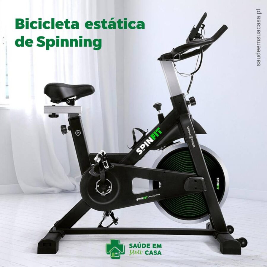 Uma Bicicleta Estática de Spinning preta e verde.