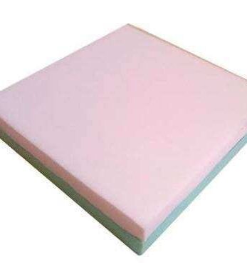 Cojín viscoelástico HR Premium rosa y verde sobre fondo blanco.