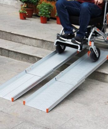 Man in wheelchair using Telescopic Ramp T2 - 203cmx40cm.