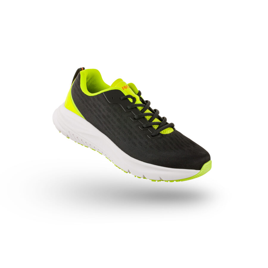 A black and neon yellow ActionPro with a white sole is suspended in the air against a white background.