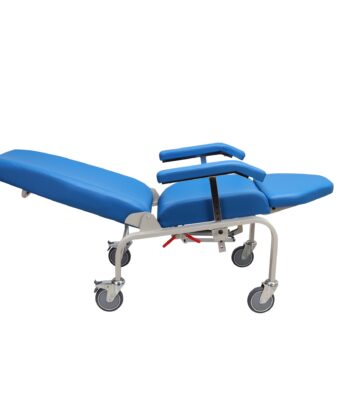 A blue reclining medical chair with an adjustable backrest and leg rest on four wheels, with two padded armrests and a safety strap.